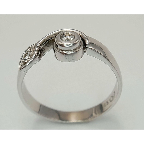 49 - Sophisticated and Elegant 14 CARAT WHITE GOLD and DIAMOND RING. Having a simple single flower to top... 