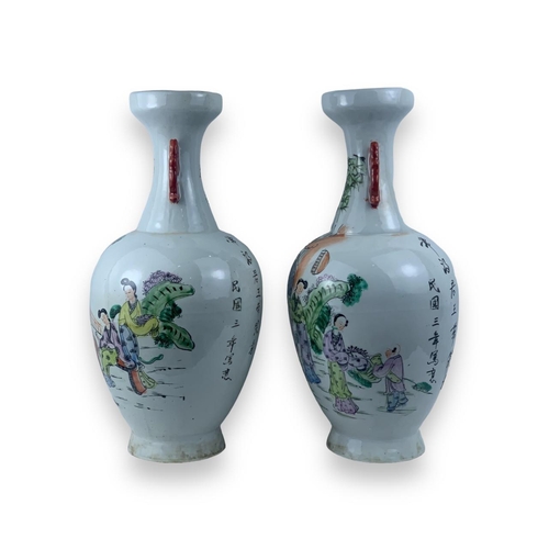 1355 - A Pair of antique Chinese Famille Rose Porcelain Vases. White porcelain exterior with multicolored h... 