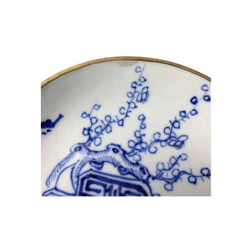 1362 - A set of antique Qing Dynasty Chinese blue and white porcelain tea plate and cup, featuring delicate... 