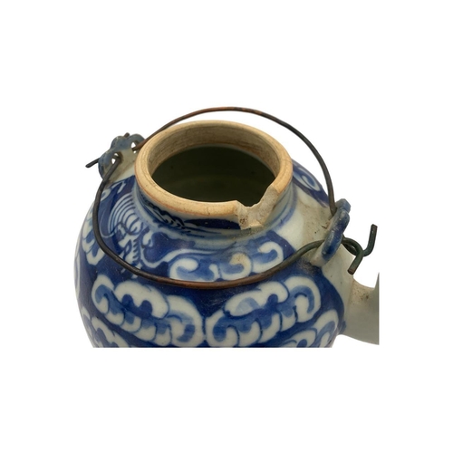 1369 - A set of antique Ming dynasty Chinese blue and white porcelain tea pot and tea bowl, featuring cloud... 