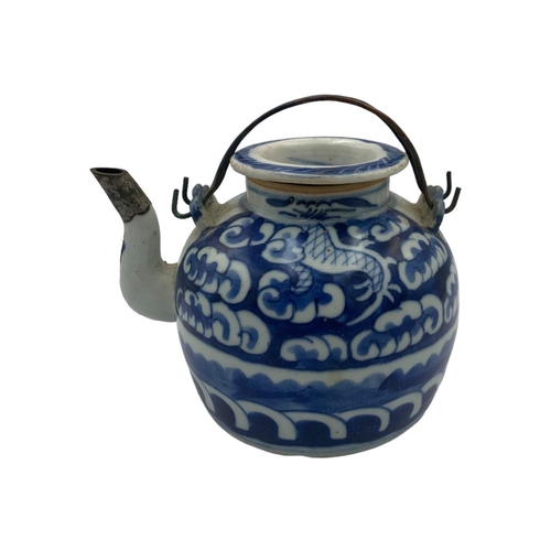 1369 - A set of antique Ming dynasty Chinese blue and white porcelain tea pot and tea bowl, featuring cloud... 