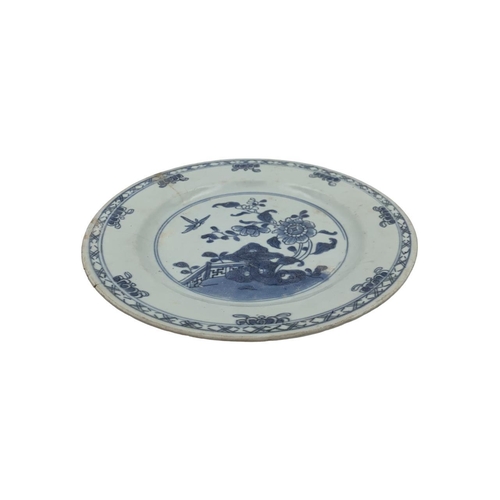 1377 - Two antique Kangxi Chinese blue and white porcelain plates. The first plate features floral and bird... 