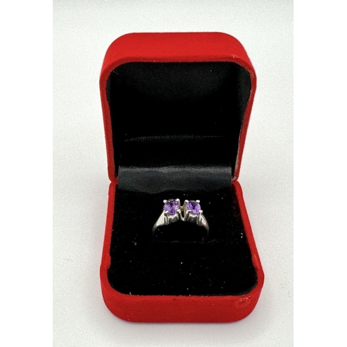 1752 - An Amethyst Two Gemstone Ring. Set in 925 Sterling silver.
Size P. HV2312