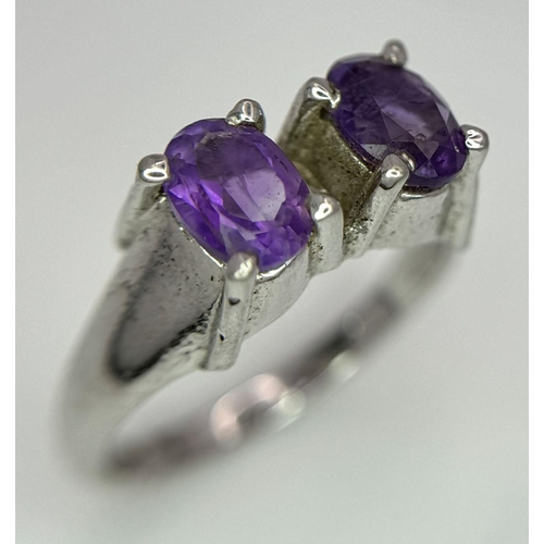 1752 - An Amethyst Two Gemstone Ring. Set in 925 Sterling silver.
Size P. HV2312