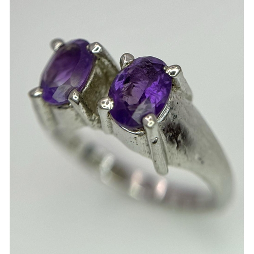 1752 - An Amethyst Two Gemstone Ring. Set in 925 Sterling silver.
Size P. HV2312