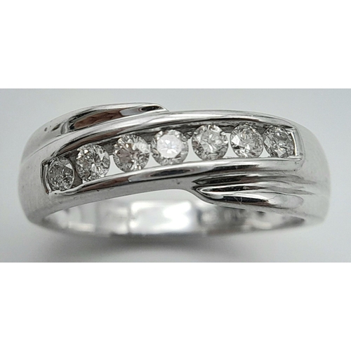 123 - AN 18K WHITE GOLD DIAMOND CROSSOVER RING - 0.25CTW. 4.4G. SIZE M 1/2. SPEN6003