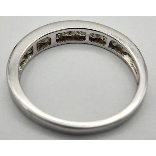 228 - AN 18K WHITE GOLD DIAMOND HALF ETERNITY RING - 0.50CTW. 3G. SIZE P. JR17.