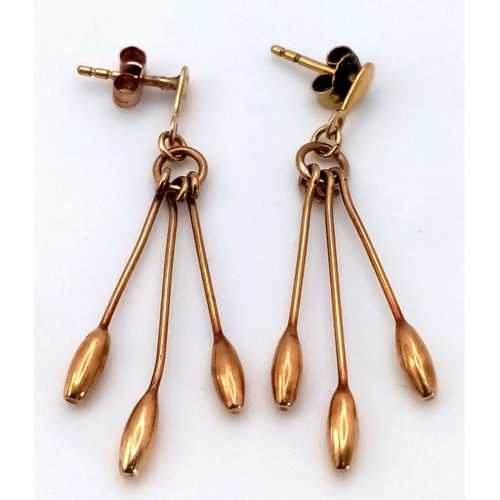 301 - Impressive pair of 9 carat GOLD, PENDULUM EARRINGS, each earring having 3 x baton pendulums with att... 