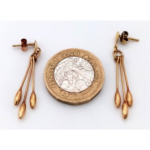 301 - Impressive pair of 9 carat GOLD, PENDULUM EARRINGS, each earring having 3 x baton pendulums with att... 