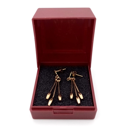 301 - Impressive pair of 9 carat GOLD, PENDULUM EARRINGS, each earring having 3 x baton pendulums with att... 