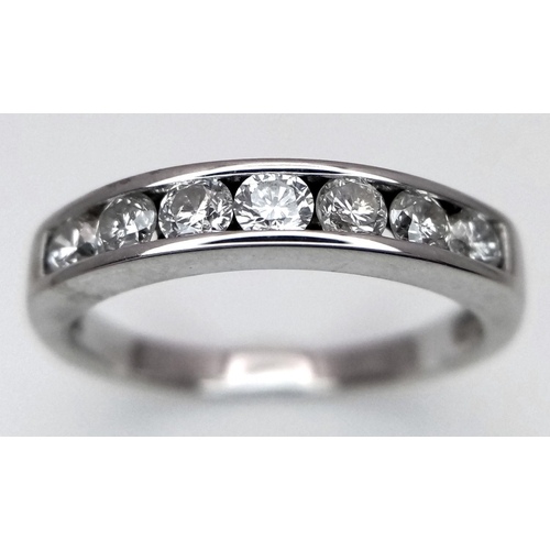 333 - AN 18K WHITE GOLD DIAMOND HALF ETERNITY RING - 0.35CTW. 3.1G. SIZE L.