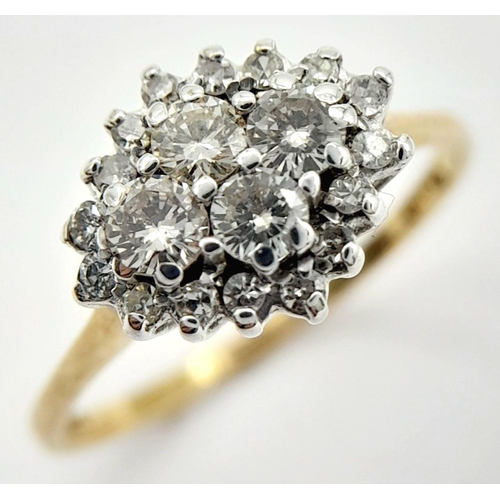 424 - A 9K YELLOW GOLD DIAMOND CLUSTER RING - 0.55CTW. 1.9G. SIZE P. TAN6002