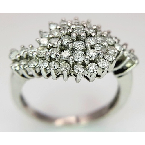 438 - A 9K WHITE GOLD ( TESTED ) DIAMOND FANCY SPIRAL CLUSTER RING - 0.50CTW. 3G. SIZE I. TAN6005