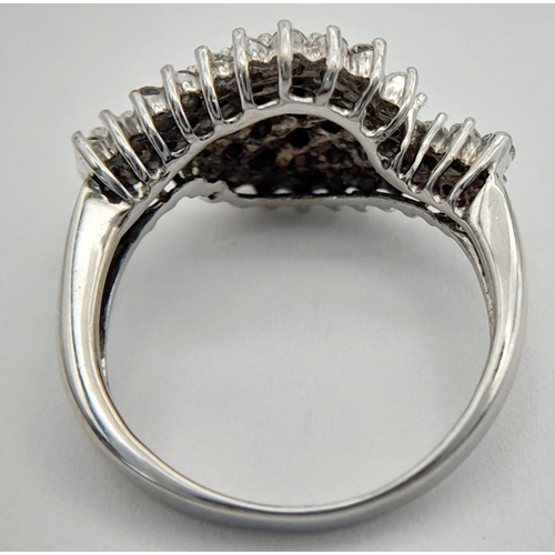 438 - A 9K WHITE GOLD ( TESTED ) DIAMOND FANCY SPIRAL CLUSTER RING - 0.50CTW. 3G. SIZE I. TAN6005