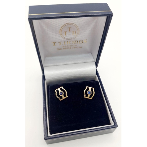 518 - A beautiful pair of 9 carat GOLD STUD EARRINGS with SAPPHIRE Centre. Complete with gold backs . Pres... 