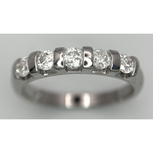 521 - A 9K WHITE GOLD DIAMOND BAND RING - 0.50CTW. 2.5G. SIZE M. SC6056