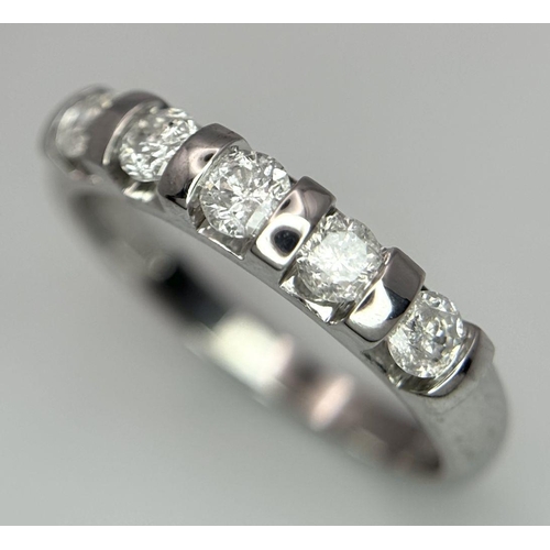 521 - A 9K WHITE GOLD DIAMOND BAND RING - 0.50CTW. 2.5G. SIZE M. SC6056