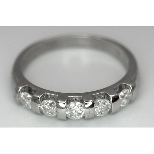 521 - A 9K WHITE GOLD DIAMOND BAND RING - 0.50CTW. 2.5G. SIZE M. SC6056