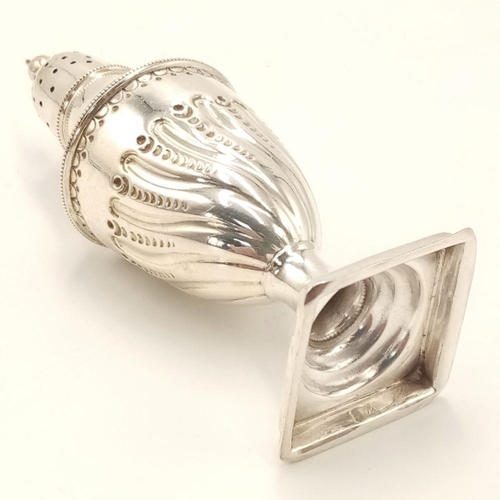 525 - A majestic ANTIQUE SILVER PEPPER POT. Clear Hallmark for Henry Atkin, 
Sheffield 1888. Beautifully d... 