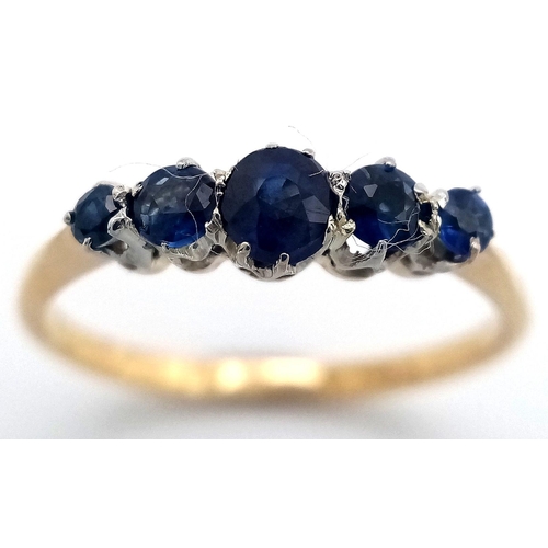 535 - AN 18K YELLOW GOLD SAPPHIRE SET FIVE STONE RING - 1.6G. SIZE N. TAN6022.