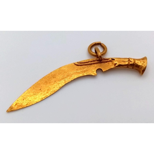 653 - A 21K Yellow Gold Curved Sword Pendant. 4cm. 2.8g