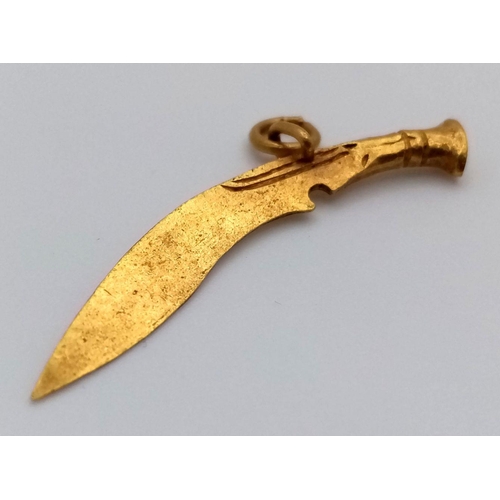 653 - A 21K Yellow Gold Curved Sword Pendant. 4cm. 2.8g