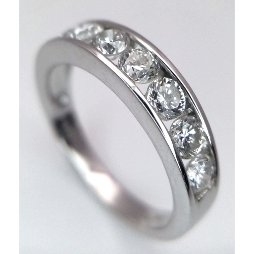 94 - AN 18K WHITE GOLD DIAMOND HALF ETERNITY RING - 1.04CTW. 3.7G. SIZE N.