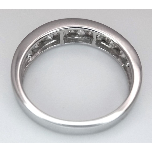 94 - AN 18K WHITE GOLD DIAMOND HALF ETERNITY RING - 1.04CTW. 3.7G. SIZE N.