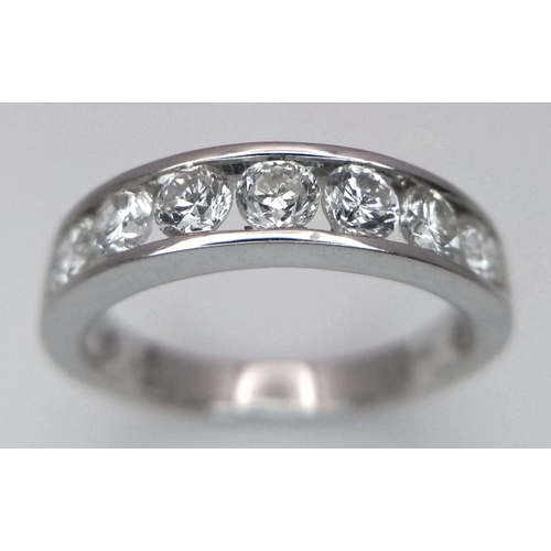 94 - AN 18K WHITE GOLD DIAMOND HALF ETERNITY RING - 1.04CTW. 3.7G. SIZE N.