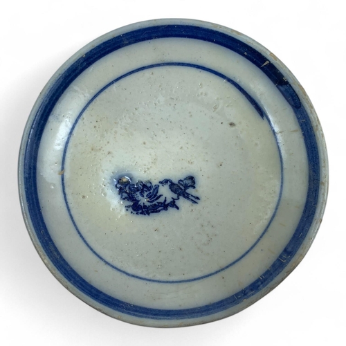 1327 - An antique set of Japanese blue and white porcelain dishes with various symbolic markings. Hand-pain... 