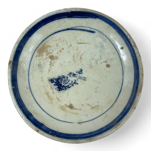 1327 - An antique set of Japanese blue and white porcelain dishes with various symbolic markings. Hand-pain... 