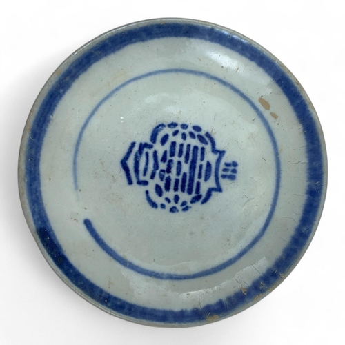 1327 - An antique set of Japanese blue and white porcelain dishes with various symbolic markings. Hand-pain... 