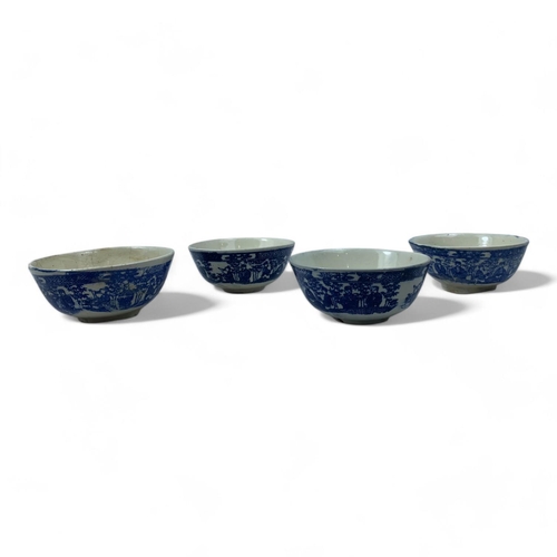 1334 - An antique set of four Chinese Blue and White Ceramic Bowls. Hand painted floral and figure motifs. ... 