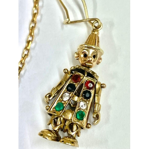 682 - A 9ct gold jewellery set featuring an articulated clown pendant, chain, and matching earrings with s... 