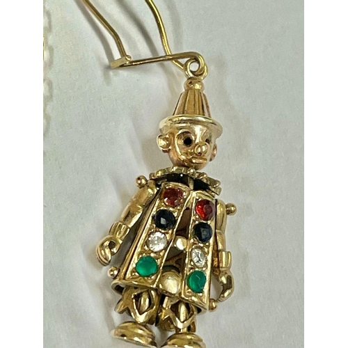 682 - A 9ct gold jewellery set featuring an articulated clown pendant, chain, and matching earrings with s... 