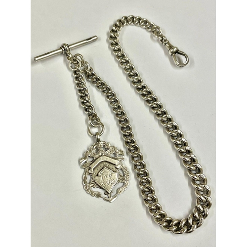 877 - An impressive silver Albert watch chain featuring T-bar, clips, and fob. Crafted in silver.