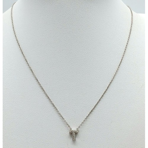 528 - 14K WHITE GOLD DIAMOND SET INITIAL' T' PENDANT ON CHAIN. 2.3G. sc6063