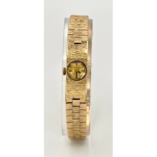 15 - A Vintage 9k Gold Accurist Ladies Watch. 9k gold bracelet and case - 10.5mm. Patinaed dial. 17 Jewel... 