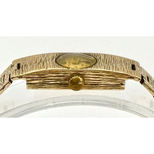 15 - A Vintage 9k Gold Accurist Ladies Watch. 9k gold bracelet and case - 10.5mm. Patinaed dial. 17 Jewel... 