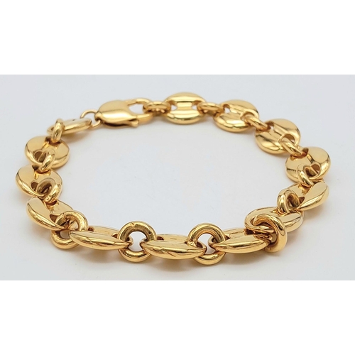 2000 - A GOLD PLATED SILVER COFFEE BEAN BRACELET .    42.8gms