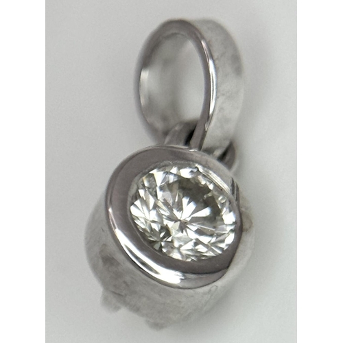 1904 - A 0.20ct Diamond Pendant set in White Gold. 0.6g total weight.