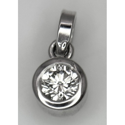 1904 - A 0.20ct Diamond Pendant set in White Gold. 0.6g total weight.