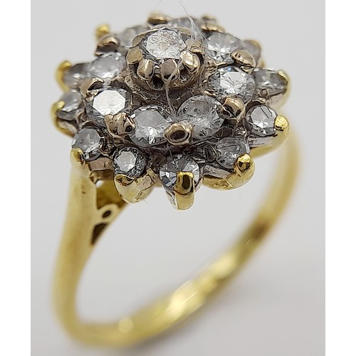 32 - AN 18K YELLOW GOLD DIAMOND CLUSTER RING - 0.60CTW. 4.8G. SIZE L. TAN6017.