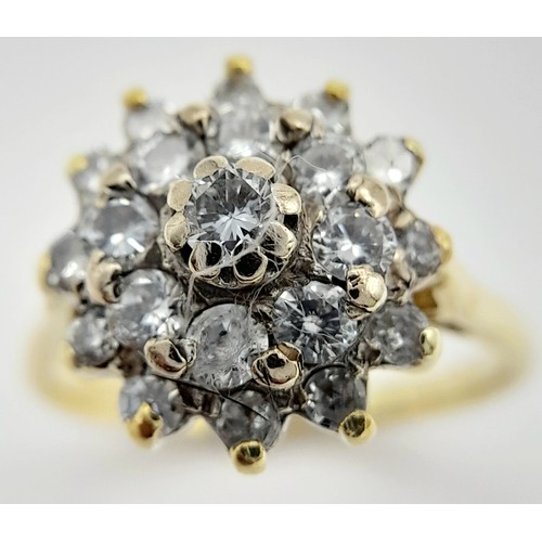 32 - AN 18K YELLOW GOLD DIAMOND CLUSTER RING - 0.60CTW. 4.8G. SIZE L. TAN6017.