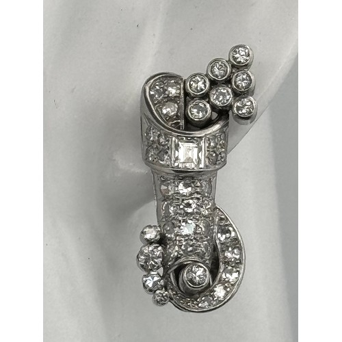 46 - A Gorgeous Art Deco Platinum and Diamond Brooch. Twin scrolled cones with an array of diamond decora... 