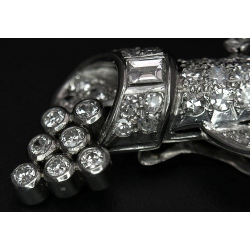 46 - A Gorgeous Art Deco Platinum and Diamond Brooch. Twin scrolled cones with an array of diamond decora... 