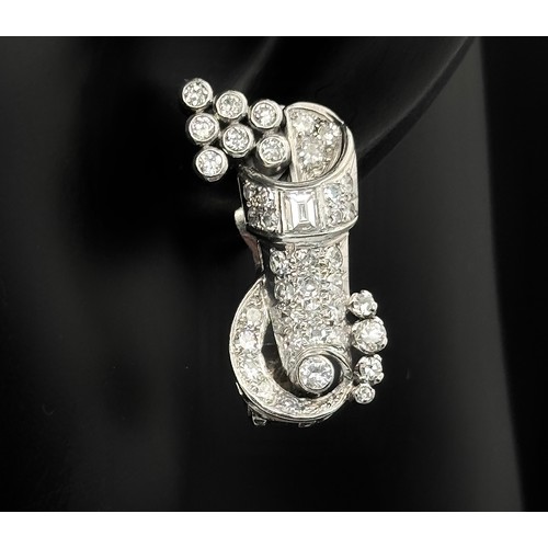 46 - A Gorgeous Art Deco Platinum and Diamond Brooch. Twin scrolled cones with an array of diamond decora... 