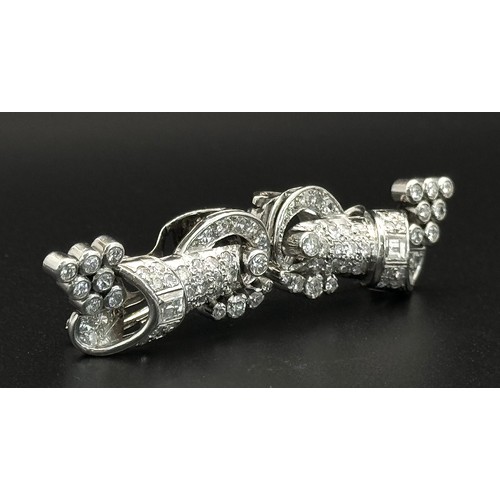 46 - A Gorgeous Art Deco Platinum and Diamond Brooch. Twin scrolled cones with an array of diamond decora... 