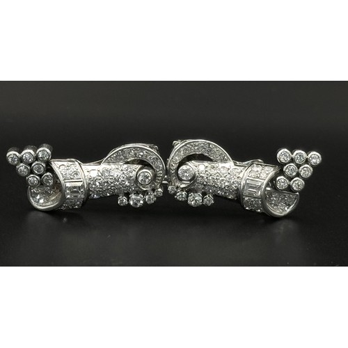 46 - A Gorgeous Art Deco Platinum and Diamond Brooch. Twin scrolled cones with an array of diamond decora... 