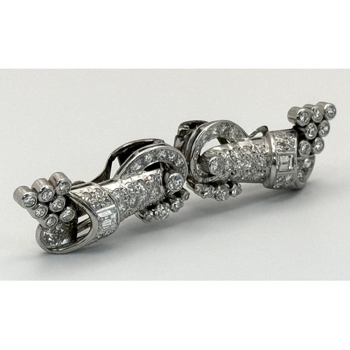 46 - A Gorgeous Art Deco Platinum and Diamond Brooch. Twin scrolled cones with an array of diamond decora... 